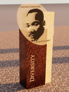 Rendering of the Diversity history marker, portraying the Reverend Dr. Martin Luther King with his words inscribed.